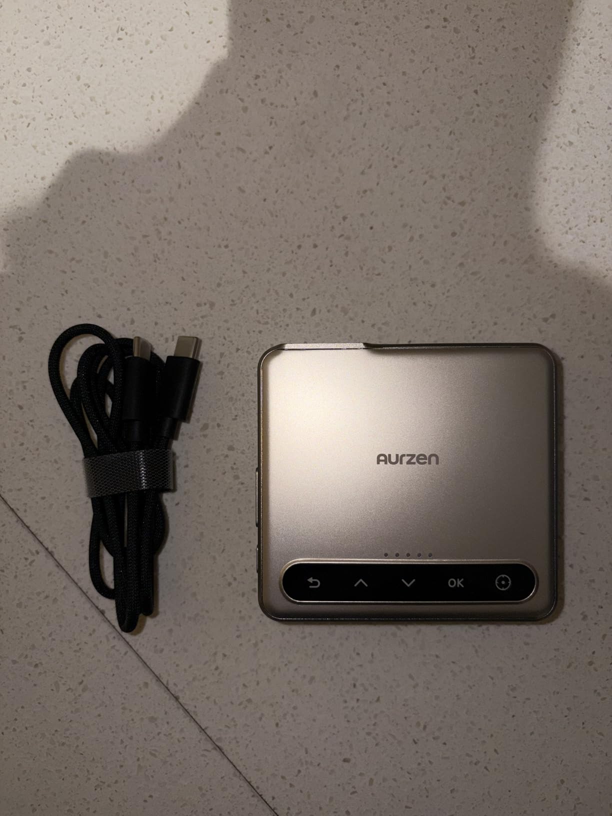 Aurzen ZIP Tri-Fold DLP Ultra-Portable Mini Pocket Projector, Bluetooth 5.4, Screen Mirroring, ToF Zero-Lag Focus, 5000mAh Battery, USB-C Powered, Pico Projector for Travel, Sewing, Drawing, Gold customer photo 1