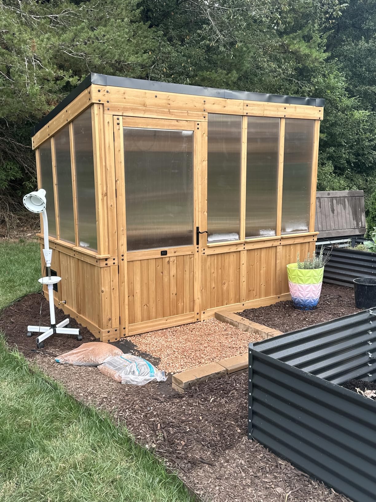Backyard Discovery Zalie 11' x 7' Cedar Wood and Polycarbonate Walk-in Greenhouse Kit with Exhaust Fan, Windows, Hose Hook-Ups, PowerPort, Staging Shelves for Year-Round Outdoor Gardening customer photo 1