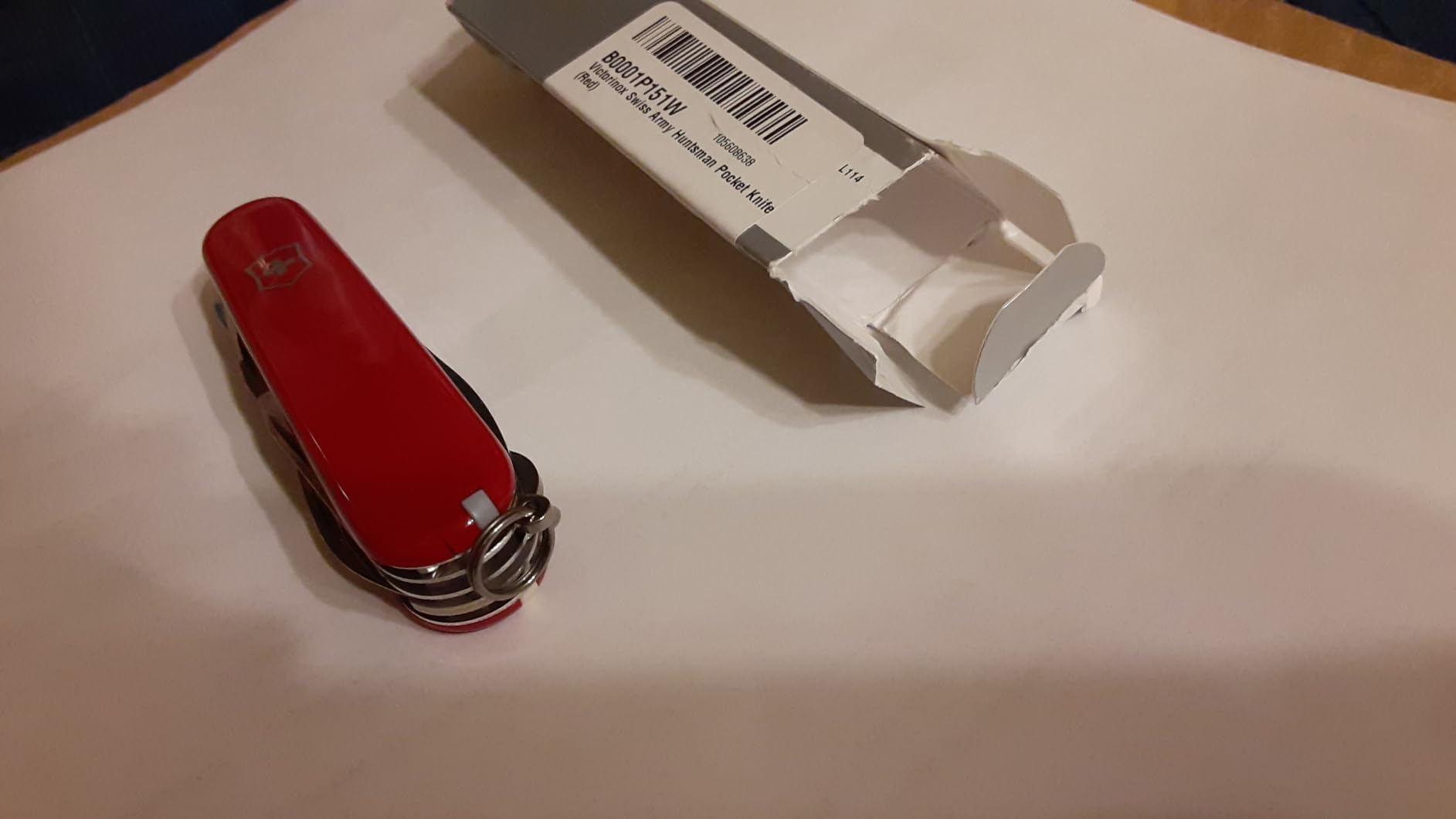 Victorinox Huntsman Swiss Army Knife, 15 Functions, Swiss Made Pocket Knife with Large Blade, Screwdriver, Scissors and Wood Saw - Red Transparent customer photo 2