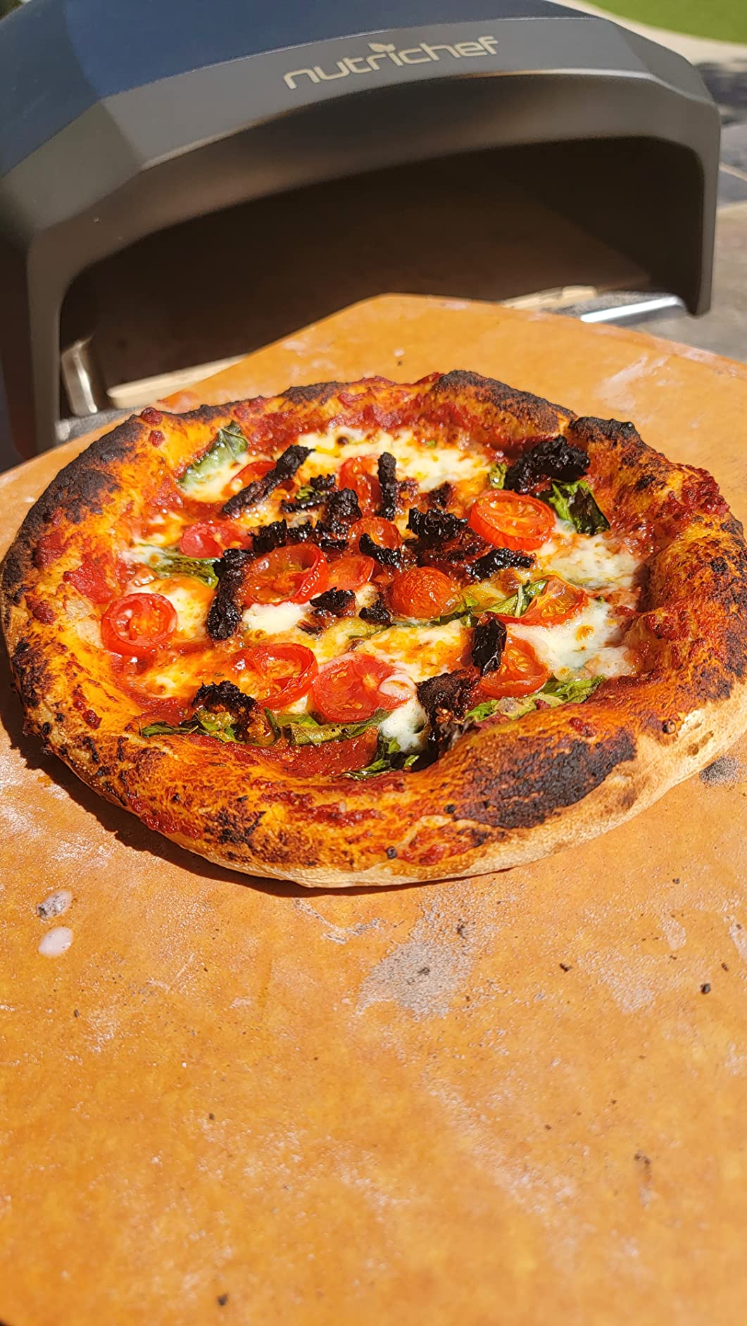 NutriChef Portable Outdoor Gas Pizza Oven - Includes Foldable Feet, Adjustable Heat Control Dial, Burner, Stone & Regulator Hose - Cooks 12