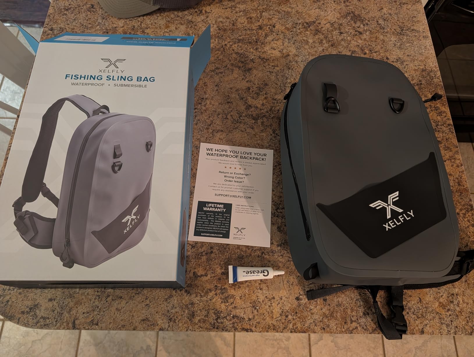 Xelfly Waterproof Fishing Sling Backpack Bag with Rod Holder, Gear Loops - Submersible Zipper, Rugged Top Handle, Adjustable Attachments (Gray) customer photo 1